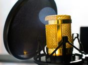 Close Up Photo of Gold-colored and Black Condenser Microphone